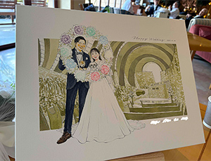 nokamiさんに描いて頂いた似顔絵は新郎新婦、わんちゃんたちの仲睦まじい雰囲気がとっても素敵で結婚式前にひと足先に感極まって泣いてしまうほどに圧巻されました！
結婚式後の食事会の場でもnokamiさんの似顔絵をサプライズで飾ったところとても映えてお二人ともとても喜んでいる様子でした！
お二人からはとても素敵な思い出となったとさっそく新居の玄関に飾ってくださったようで心からnokamiさんに依頼してよかったなと思います！
細かな要望にも柔軟に対応してくださり、また素敵なアイディアをご提案していただきながら寄り添ってくださった〇〇さん、nokamiさんこの度は本当にありがとうございました◎
